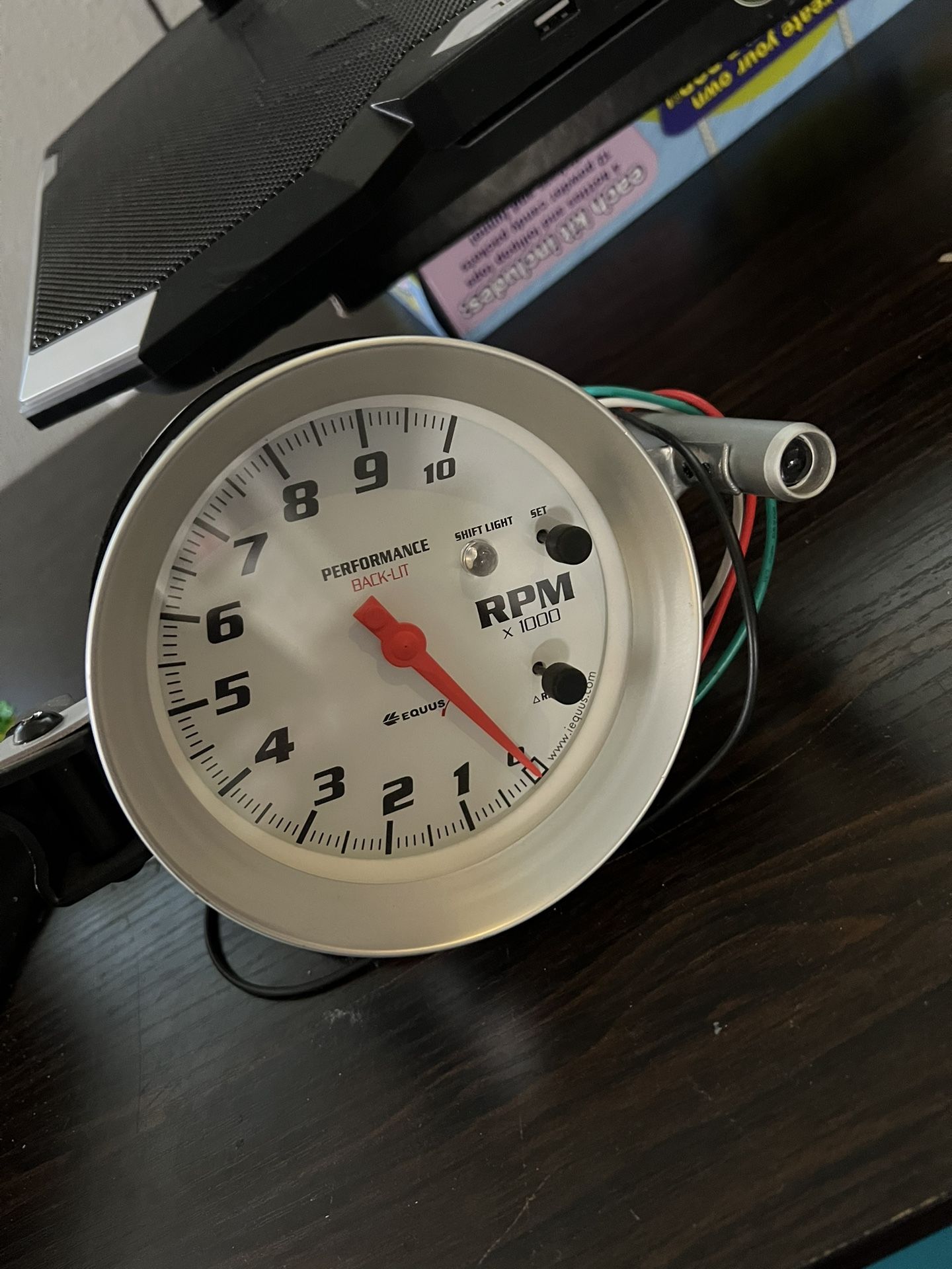 Equus Performance Back-Lit Tachometer with a shift light.