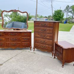 Dresser mirror, chest door, and nightstand