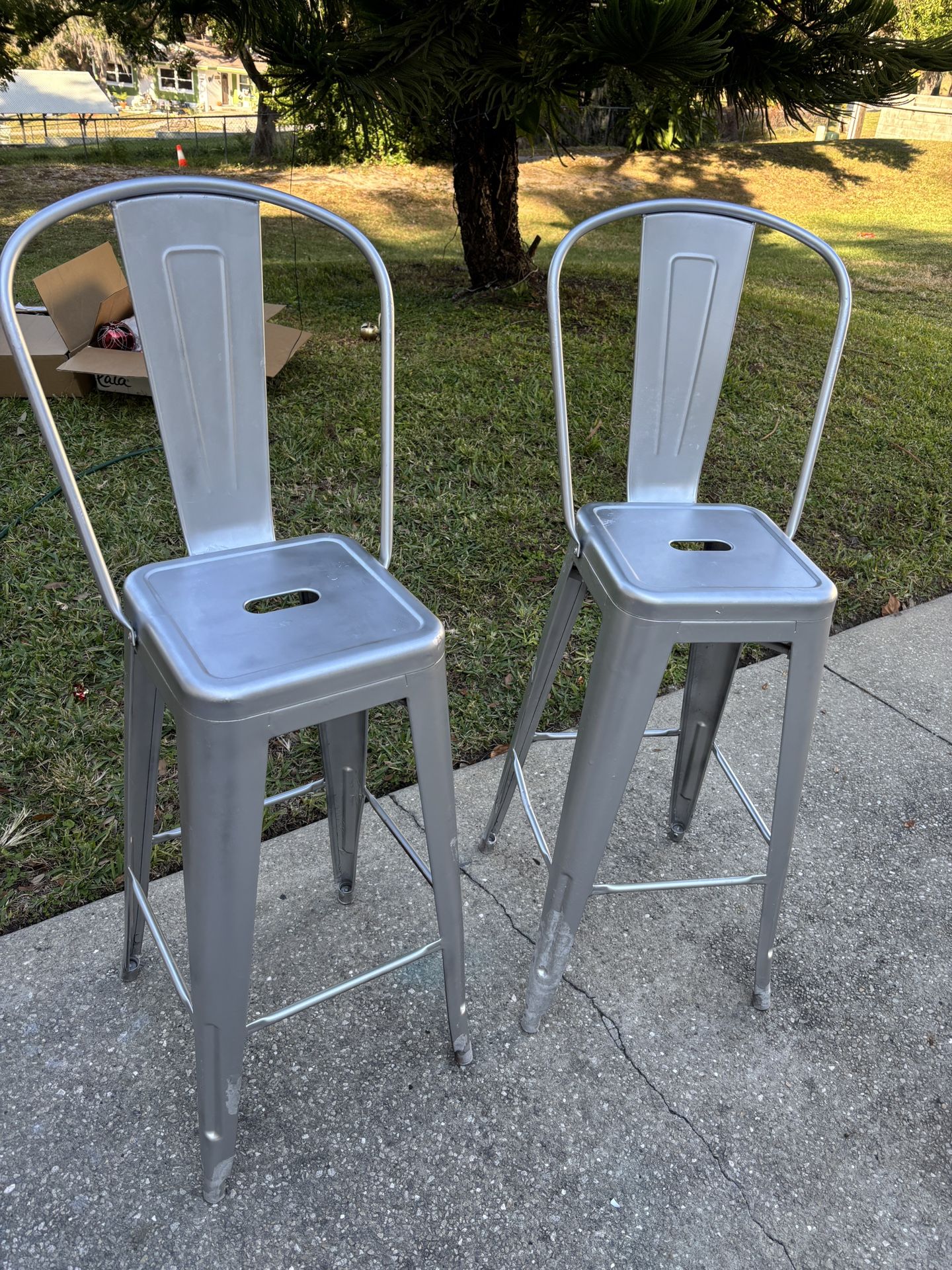 two aluminum chairs were put by the pool no need for them