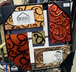 decorative metal wall collage holds two bin