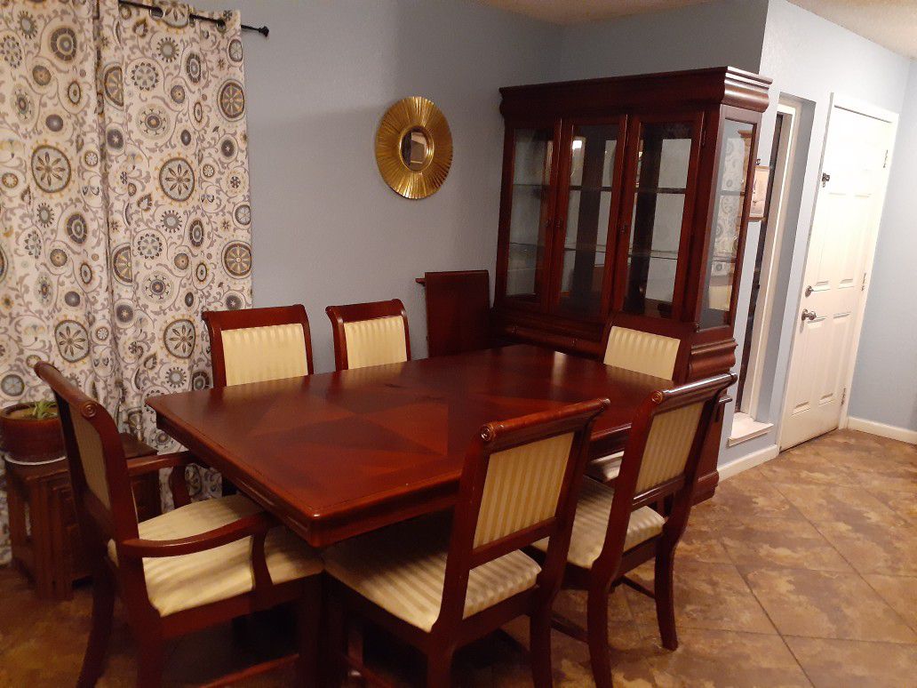 Dining room set with one leaf, six chairs and china hutch