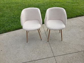 White shag chairs with adjustable feet