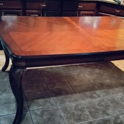 Solid wooden table with polished finish