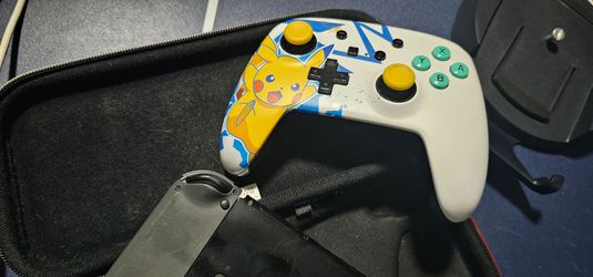 Nintendo Switch Console with Pikachu Controller and carrying case