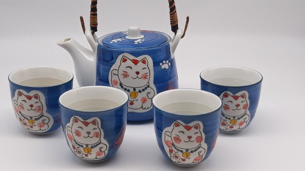 Tea Set with 4 Cups that have a cat and cat paws