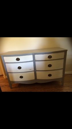 Awesome grey and white dresser. Drawers work well.