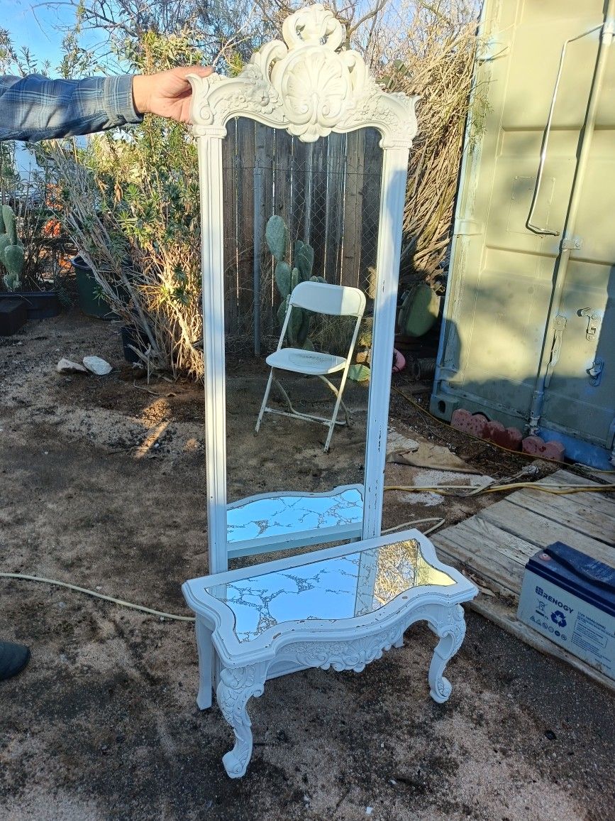 white shabby chic or distressed French-style floor mirror and matching coffee table