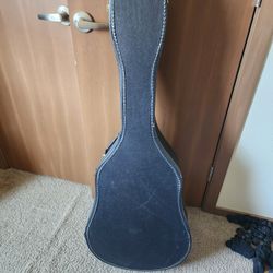 Guitar case. Used. Black. In picture 3, you can see that there are marks of ripped little pieces. 