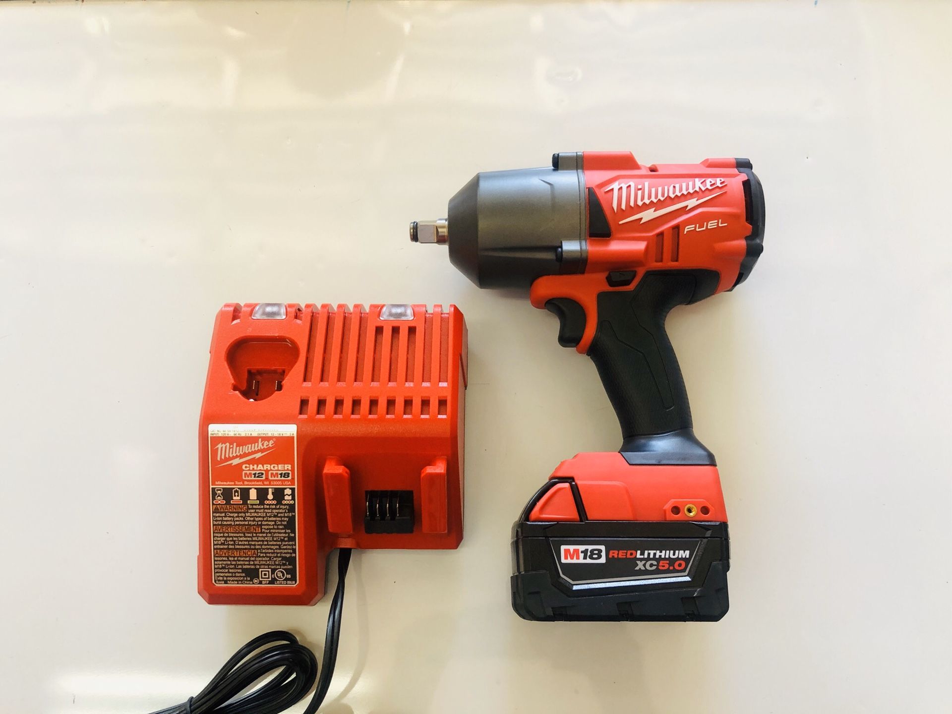 Milwaukee M18 FUEL 1/2” Impact 1400lbs torque with 5.0 battery and charger, NEW!!