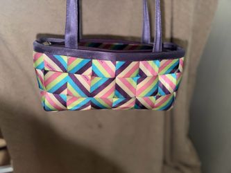 Harvey’s bag a multicolored geometric-patterned Harveys seatbelt bag with purple trim and dua