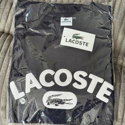 UNISEX LACOSTE T SHIRT IN A 100% COTTON BLACK 2XL SIZE WITH TAGS AND PACKAGING 