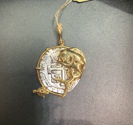 Atocha silver coin pendant in gold bezel