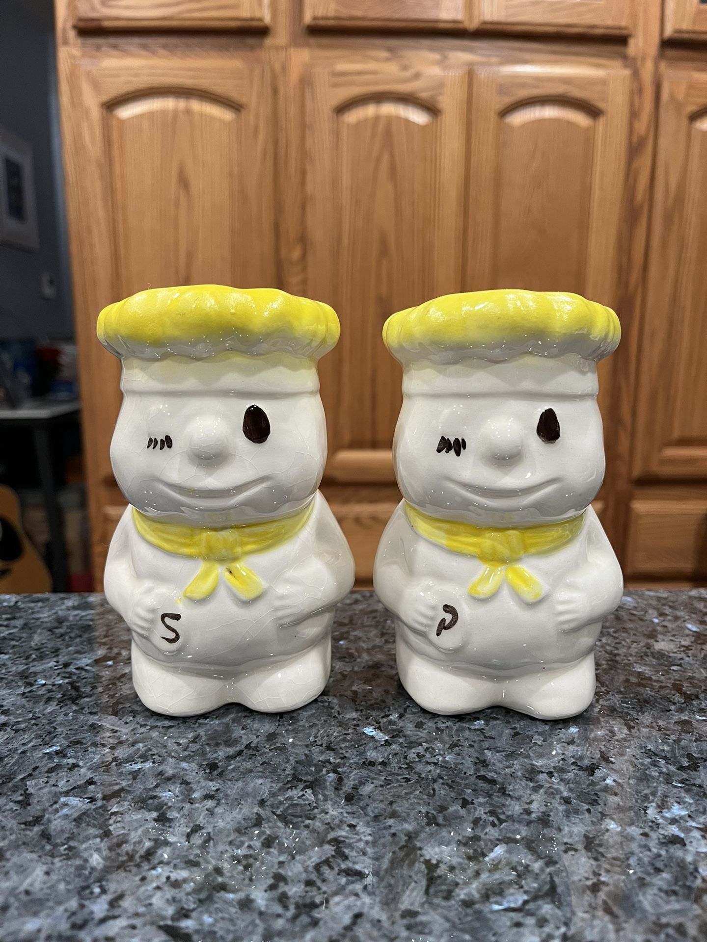 Vintage Large Pillsbury Dough Boy Winking Baker Pair of salt and pepper shakers. Size approximately 5 1/4 inches tall. Preowned, on the bottom Has