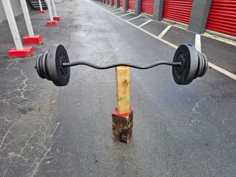 💯 pounds aprox EZ Curl Bar with Weight Plates