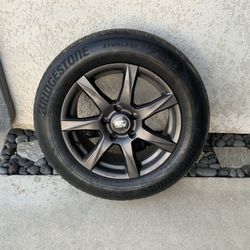 Bridgestone Blizzak Premium All-Weather Tires with rims
