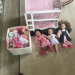 dolls and bed and bin of clothes