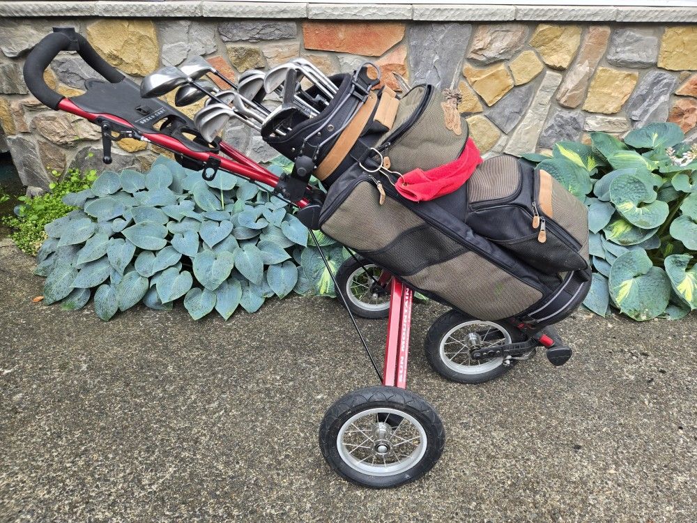 Golf Clubs And Bag With A Push Cart