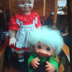 Very Large Kewpie Doll And A Very Large Troll The Kewpie Doll Is $200 And The Troll Doll Is 200 It's Very Large Came From Knott's Berry Farm In The 19