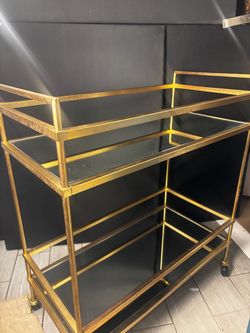vintage brass and mirror glass rolling bar cart