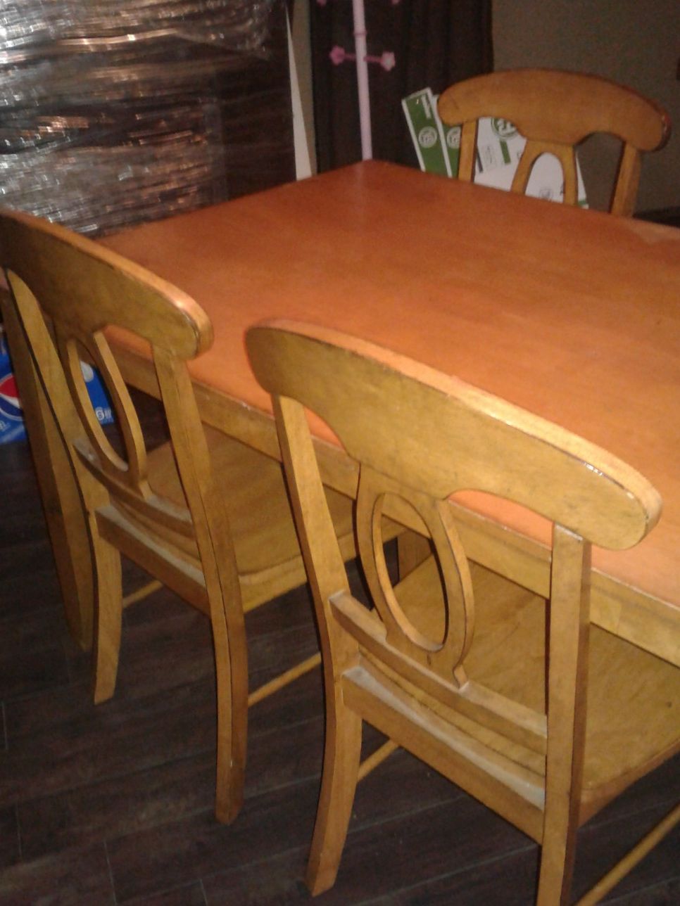 Wood table has 4 chairs good conditon