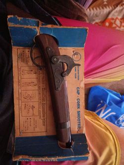 Model 1862 cat cork shooter and original packaging from 1961 to 1965