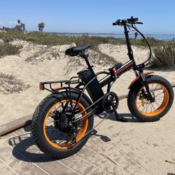 20 inch fat tire folding 500 W electric E bike new one year warranty