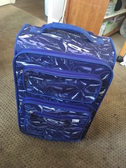 Children’s Blue Travel carry on suitcase w/wheels, pullout handle + a blue sharks print