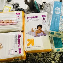 5 Packs Of Diapers - Newborn, 1, 2, And 3