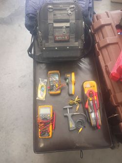 Electrical meters and hand tools with backpack tool bag