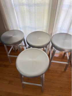 4 CB Crate & Barrel Swiveling Stools in Brushed Aluminum