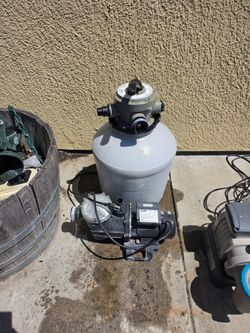 Above ground pool ladder and pumps