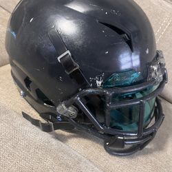 Football helmet large an two pairs of shoulder pads
