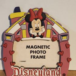 a Minnie Mouse Disneyland magnetic photo frame. 