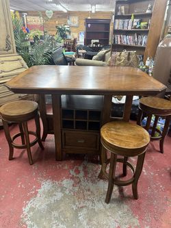 Solid wood pub style table with 4 stools