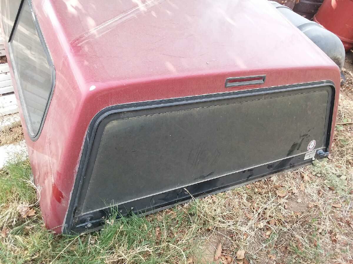 Red camper shell off a 95 f-150 short bed