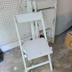 4 White wood folding chairs