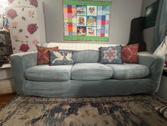 Charcoal Gray Sofa with Baby Blue Slipcover