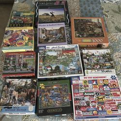 Eleven 1,000 Piece Jigsaw Puzzles 