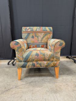 Vibrant Multi-Color Upholstered Armchair Cushion with Eclectic Pattern