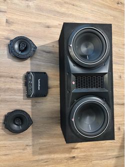Two 10” subs, 500W amp, two 45W door speakers