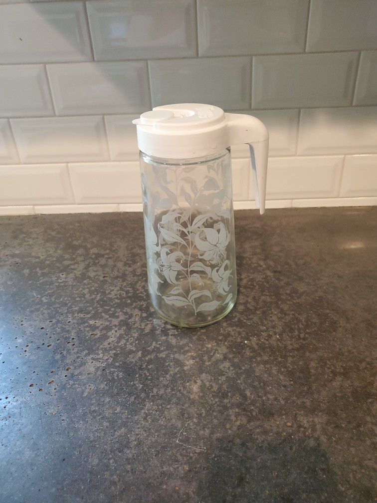 Vintage Tang glass pitcher with lid. 