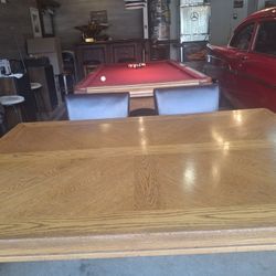 Oak dining table and seven chairs very heavy