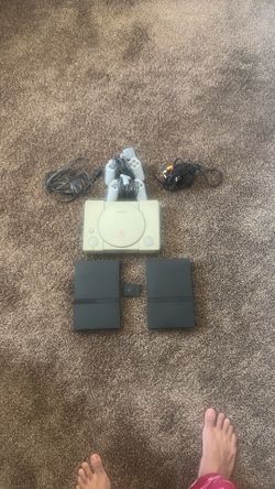 Ps1 console and controllers and 2 ps2 consoles
