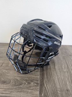 Bauer RE-AKT 155 size Medium helmet paired with an "Oreo" cage