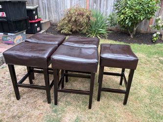 Five used counter height stools
