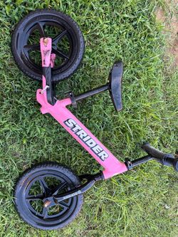 Pink strider balance bike