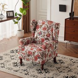 set of two floral-patterned lounge chairs, high-backed with upholstered armrests and solid legs, suitable for living rooms, bedrooms, home offices, et
