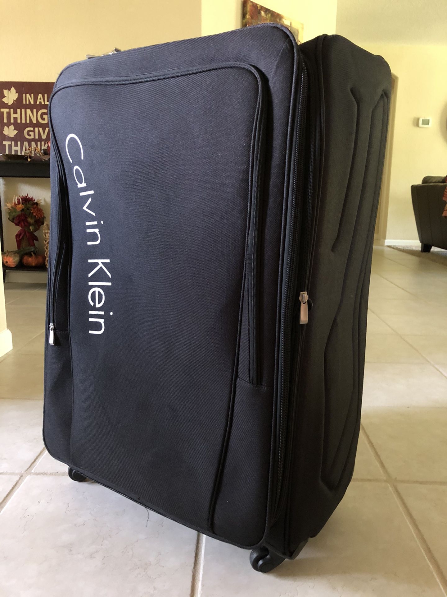 XL Calvin Klein Expandable Spinner Luggage. 34” H x 22.5” W x 12” D (Including wheels)