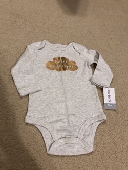 BRAND NEW: Carter’s onesie in size 9 Months