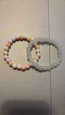 Light pastel stretchy around beads and clear/ white stretchy round bead bracelet